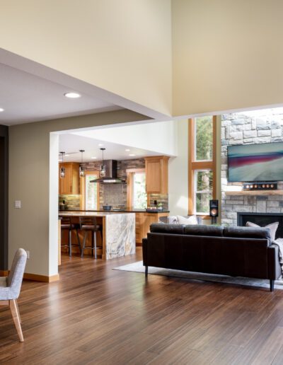 A living room with a dining table and chairs.