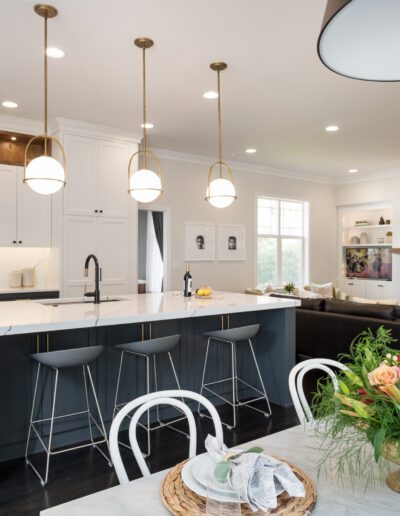 A kitchen with a dining table and chairs.