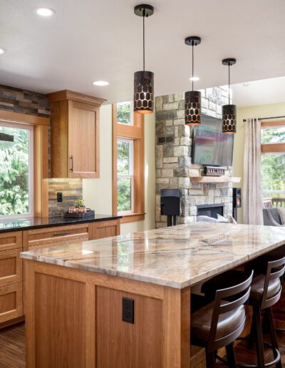 A kitchen with wood cabinets and granite counter tops.