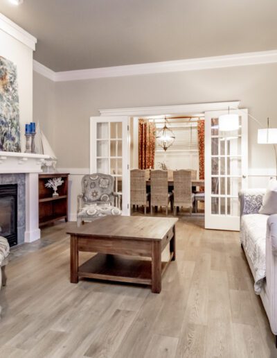 A living room with hardwood floors and a fireplace.