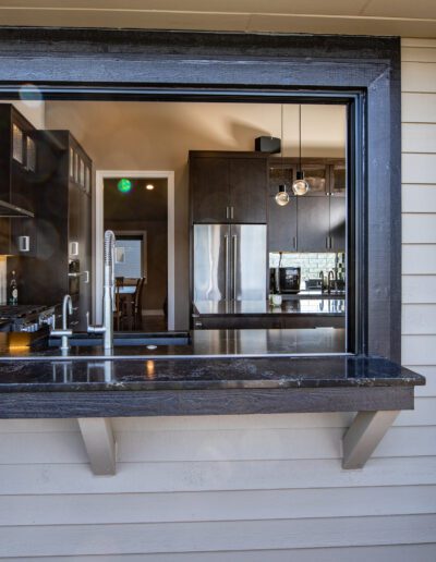 A kitchen with a sink and a counter top.