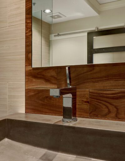 A sink in a bathroom with a mirror above it.