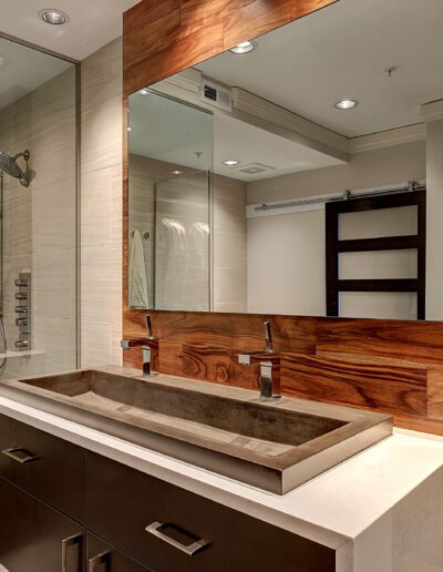 A bathroom with a sink and a shower.