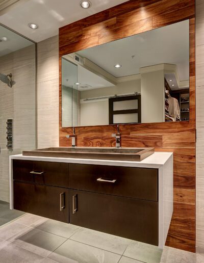 A bathroom with two sinks and a mirror.