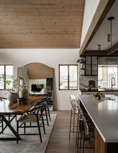 A modern kitchen with wooden ceilings and wooden floors.