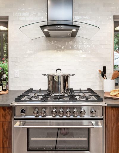 A modern kitchen with a stove and oven.