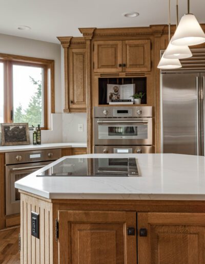 Modern kitchen with wooden cabinets, a central island with a white marble countertop, and stainless steel appliances.